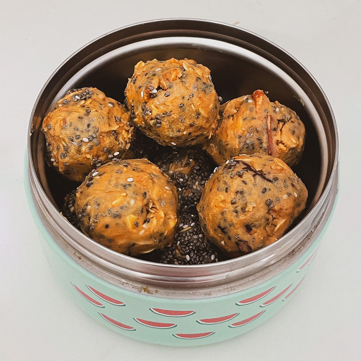 A container filled with Cosmopolitan Granola Bites